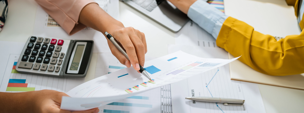 Header Image Finance Photo of person examining financial reports