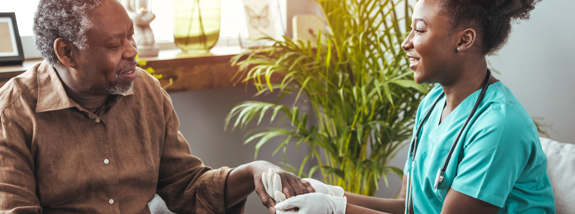 Closeup of a support hands. Closeup shot of a young woman holding a senior man&#039;s hands in comfort. Female carer holding hands of senior man