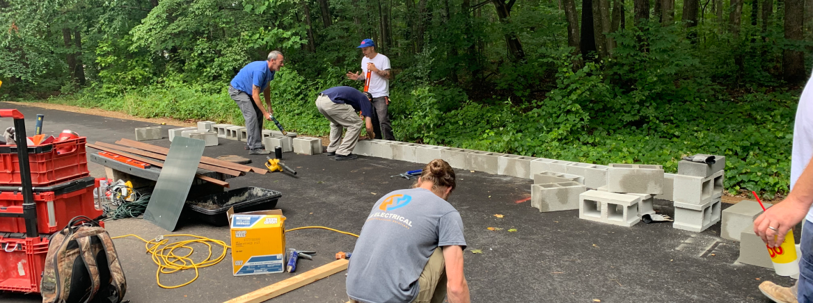 People building a DIY skate park at Kilborne Park.