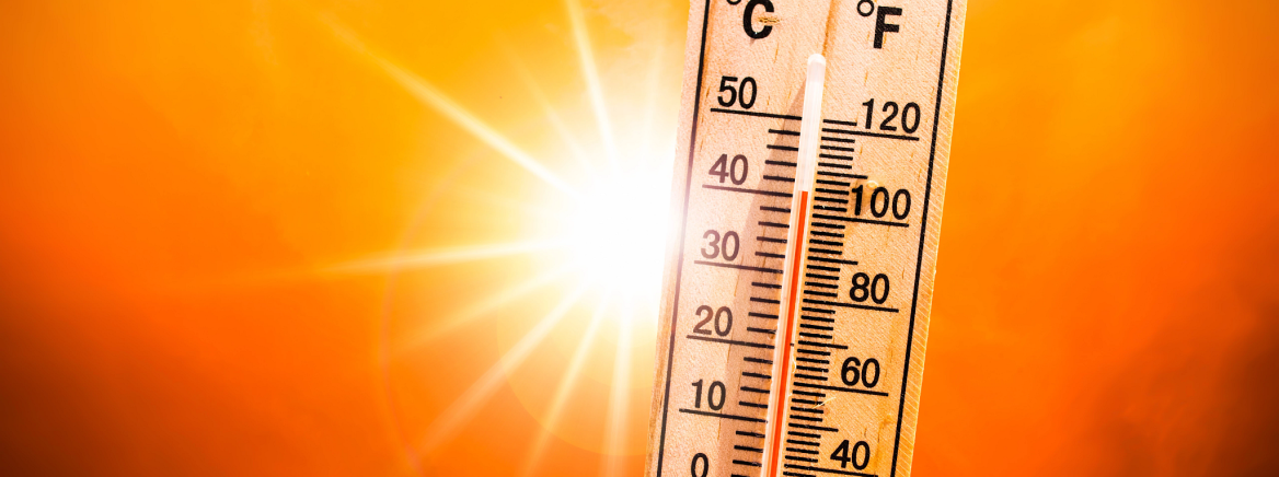 Thermometer show high temperatures with a hot sun in the background