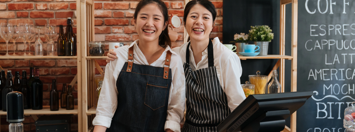 Two Asian employees working at a cafe