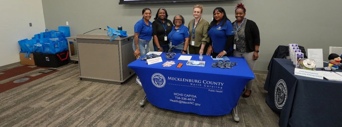 Members of Mecklenburg County Public Health at a table display during Public Health week
