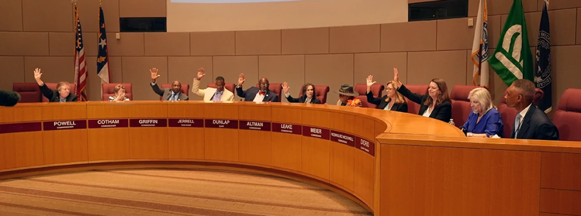 FY25 Budget Approved County commissioners sitting at the dais in the CMGC meeting chamber during a meeting.