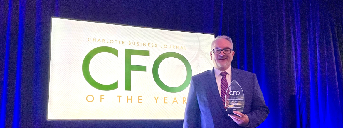 David Boyd Receives CFO Award County CFO holding the CFO of the Year Award that he received from the Charlotte Business Journal.