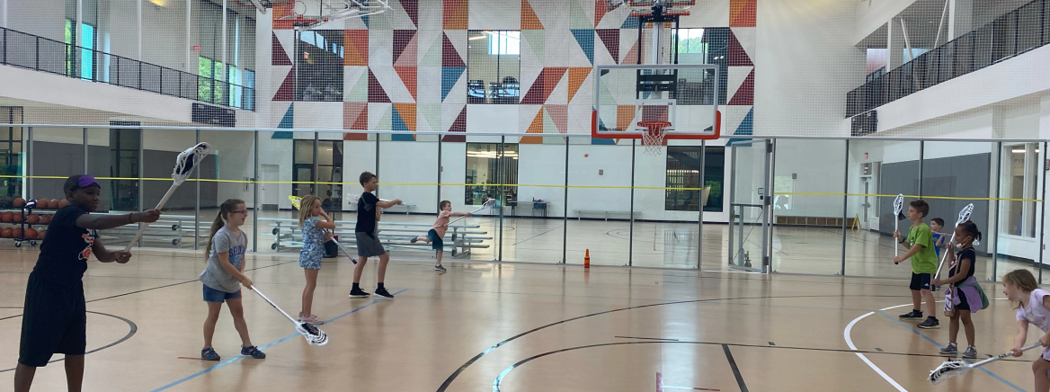 summer camp at rec center Kids participating in a summer camp activity at a recreation center.