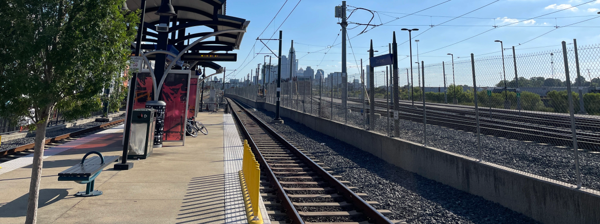 A lightrail station looking toward uptown Charlotte on a sunny day.