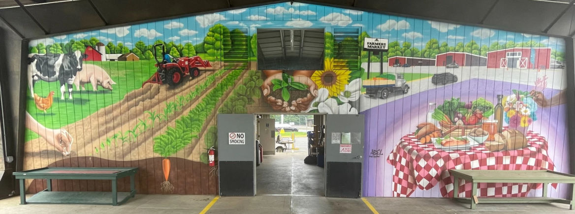 Charlotte Regional Farmers Market Mural A vibrant mural at the Charlotte Regional Farmers Market, showcasing the importance of food security, healthy eating, and the vital connections between farmers and the community.