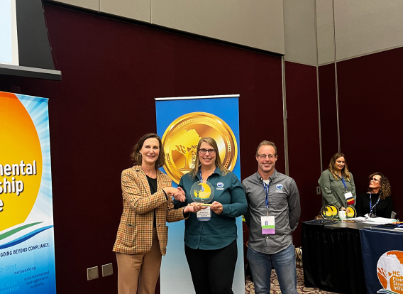Construction project managers Amber Grzymski and Darren Steinhilber accept the Rising Steward of the Year Award.