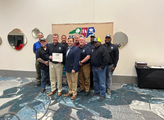 Solid Waste staff members holding the NC Department of Labor Safety Award